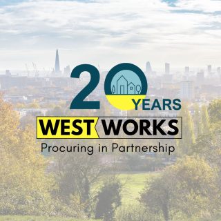 A background image of a cityscape with trees and greenery in the foreground. Westworks 20th year anniversary is overlayed in the centre of the image. It reads "20 years" "Westworks" followed by the strapline "Procuring in partnershio". The 20 years is in dark teal and yellow. there is a graphic on houses in the centre of the zero. The rest of the font in the logo is black. "Westworks" is surrouded by a black rectangular box and a chevron separates the "West" and Works" the background behind "West" is yellow. The rest has a transparent background.