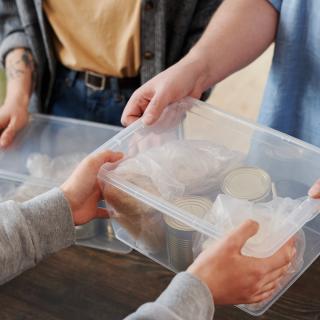 Volunteers handing over food parcels