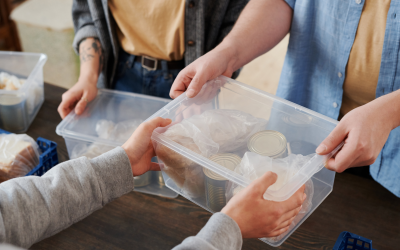 Volunteers handing over food parcels