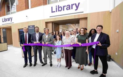 RBC-Library-Opening-compressed Reading's Mayor along with other public officials and library staff stand outside the new Reading Central Library with a purple ribbon which is about to be cut.